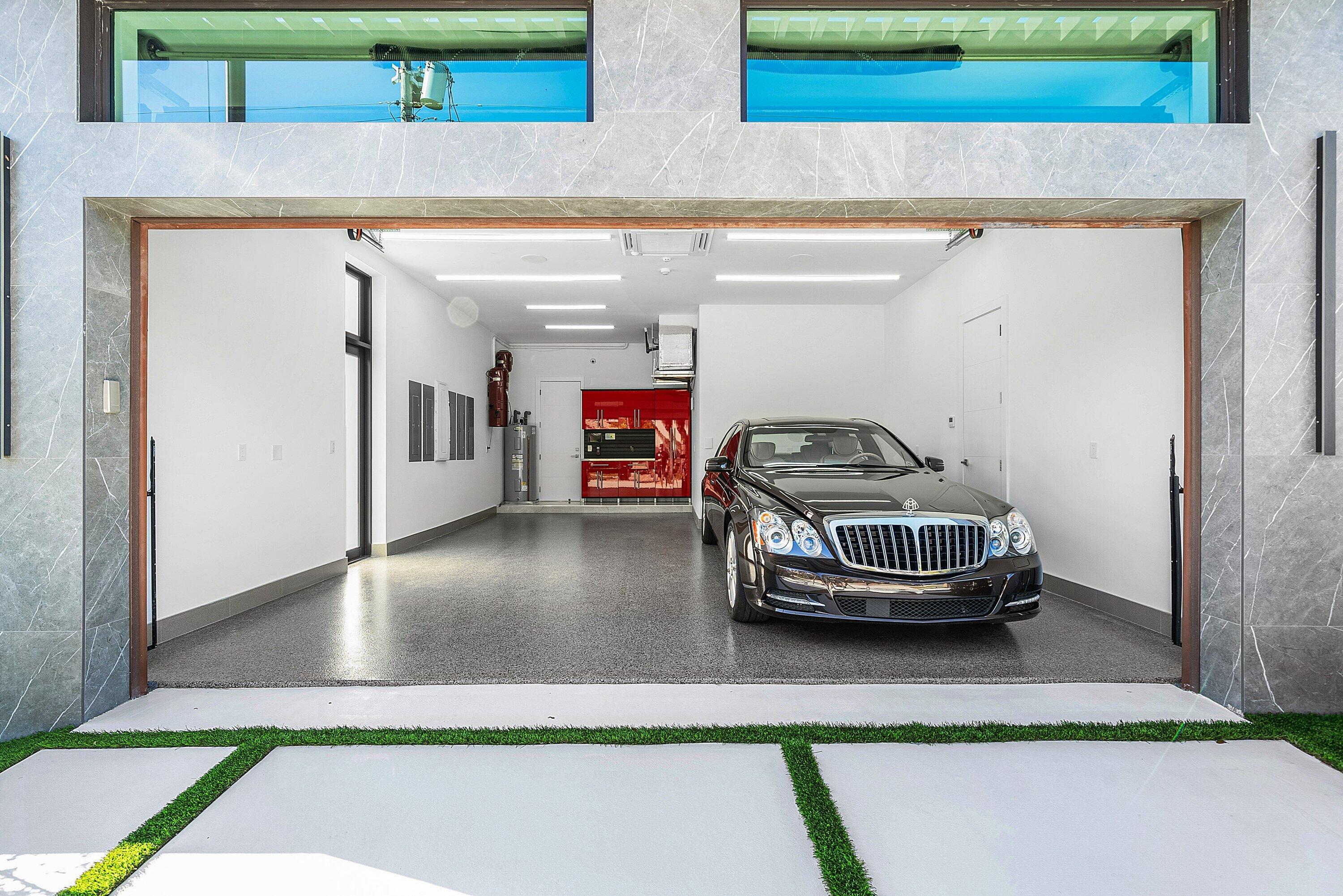 2650 Northeast 48th Court Lighthouse Point, FL 33064 - Photo 65 of 86 a car parked in front of a building