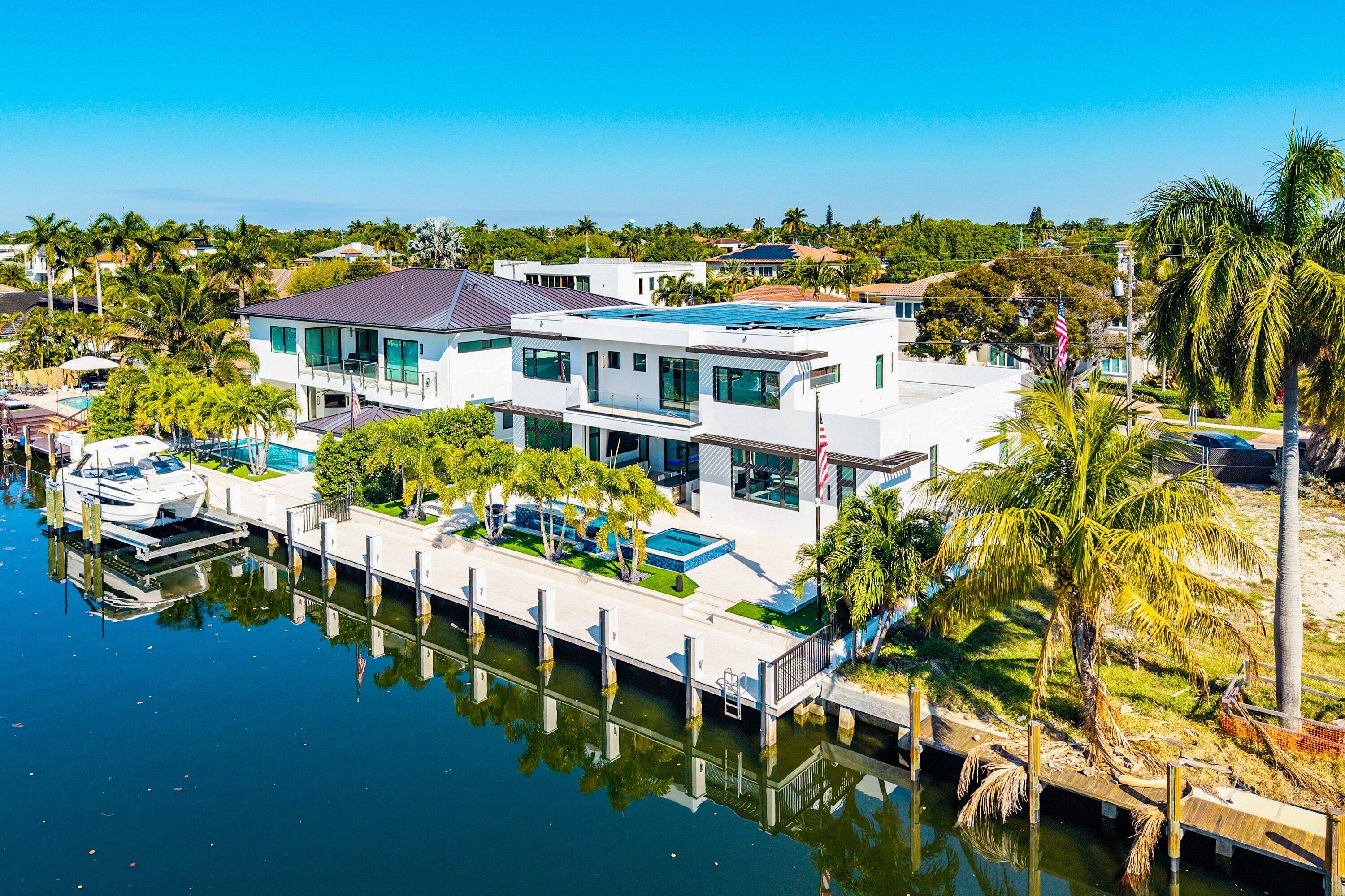 2650 Northeast 48th Court Lighthouse Point, FL 33064 - Photo 68 of 86 a view of a chairs and table in a patio