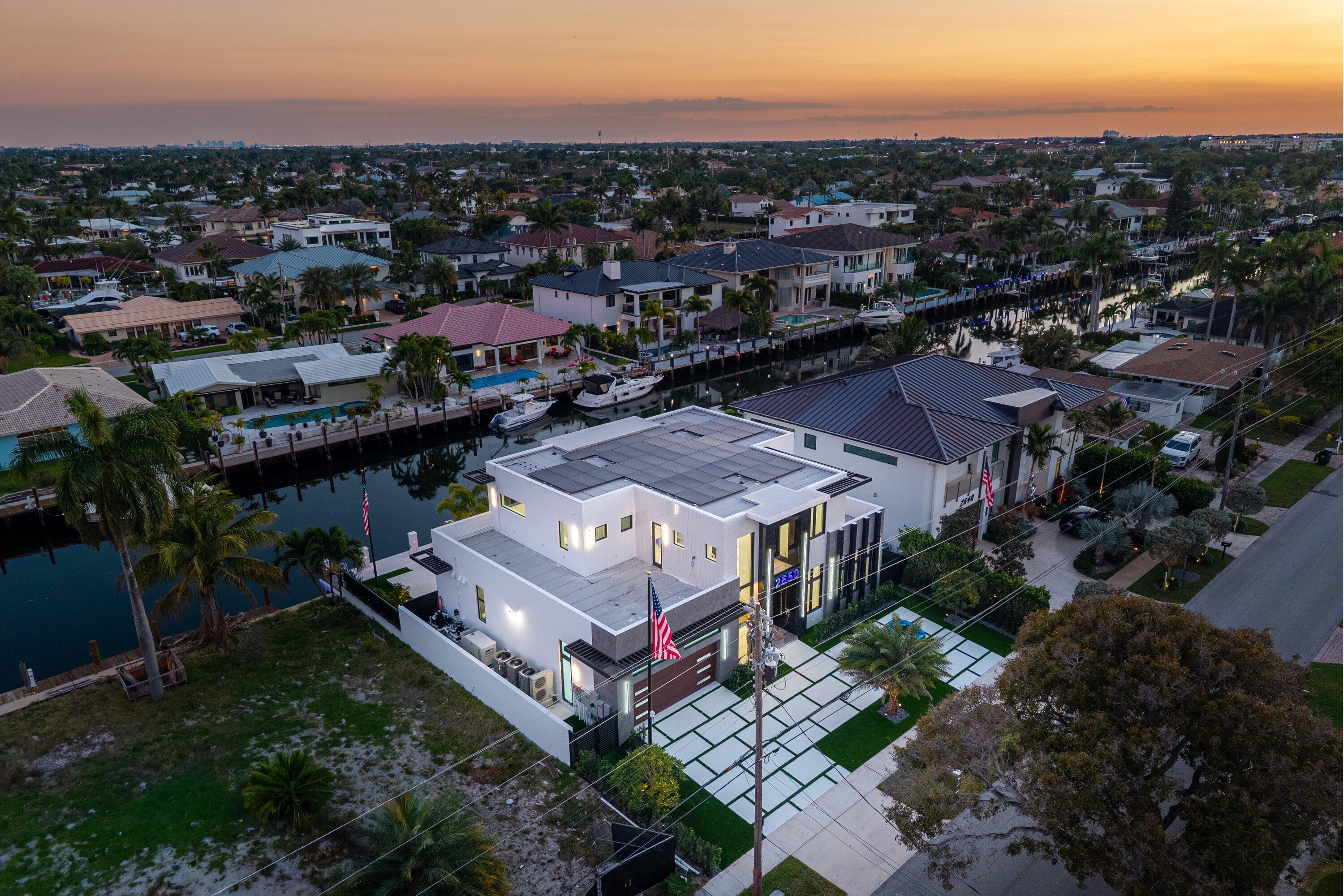 2650 Northeast 48th Court Lighthouse Point, FL 33064 - Photo 69 of 86 an aerial view of a house with a garden