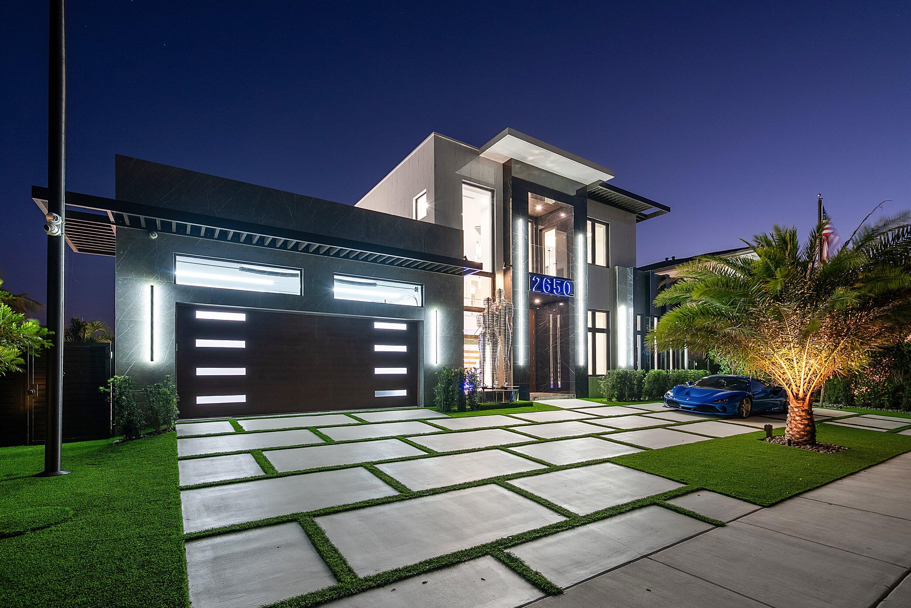 2650 Northeast 48th Court Lighthouse Point, FL 33064 - Photo 73 of 86 a front view of a house with garden