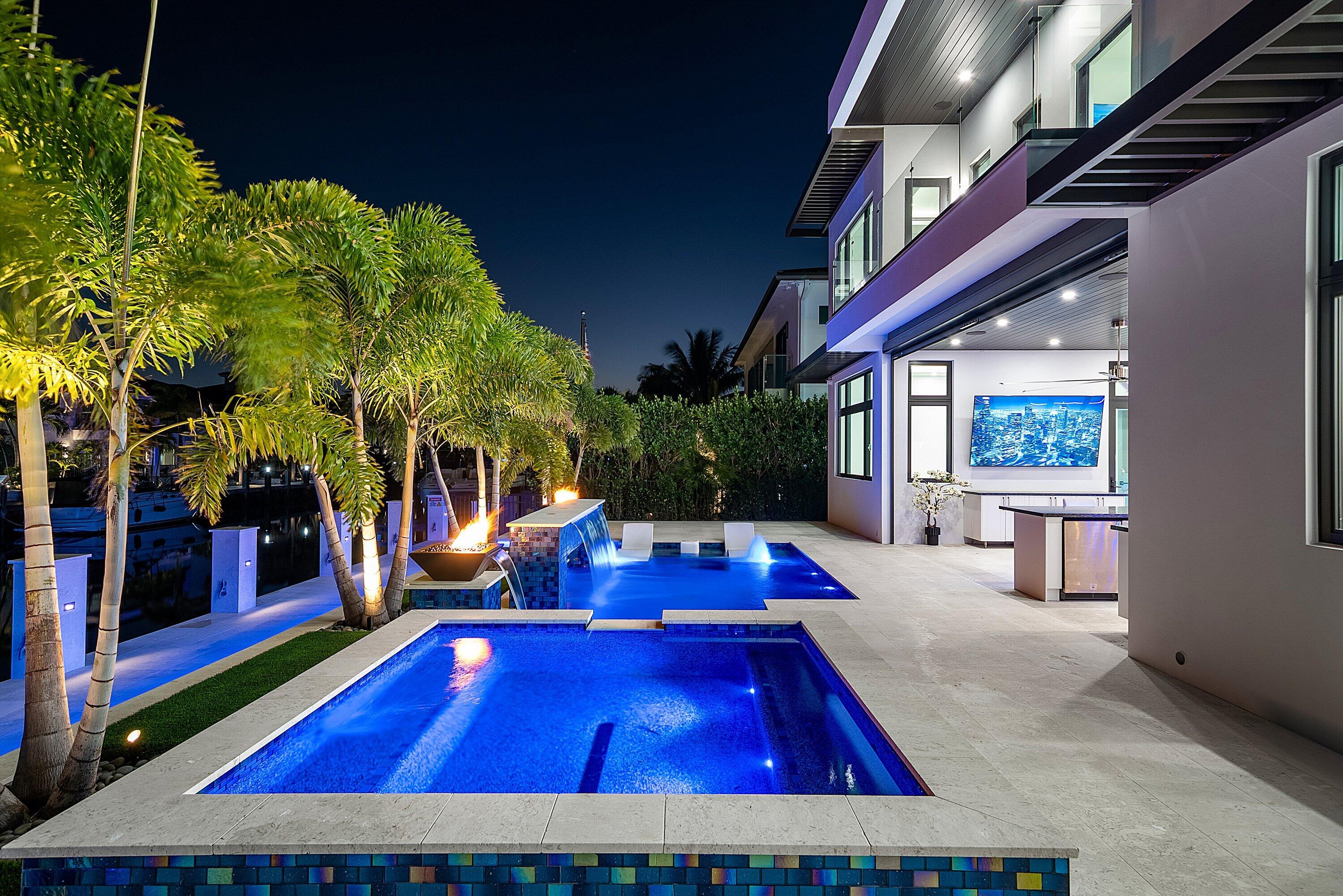 2650 Northeast 48th Court Lighthouse Point, FL 33064 - Photo 84 of 86 a view of swimming pool with seating area