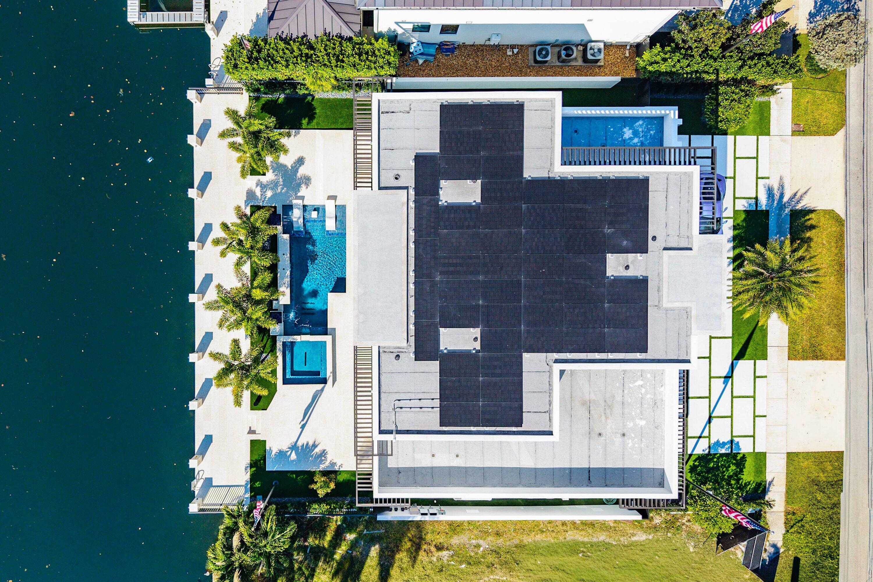 2650 Northeast 48th Court Lighthouse Point, FL 33064 - Photo 10 of 86 front view of a house with a yard