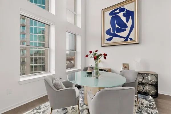 a dining room with furniture and window