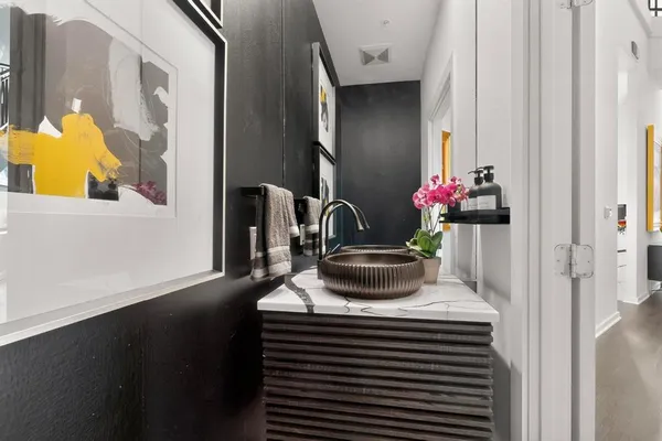 a bathroom with a sink and a mirror