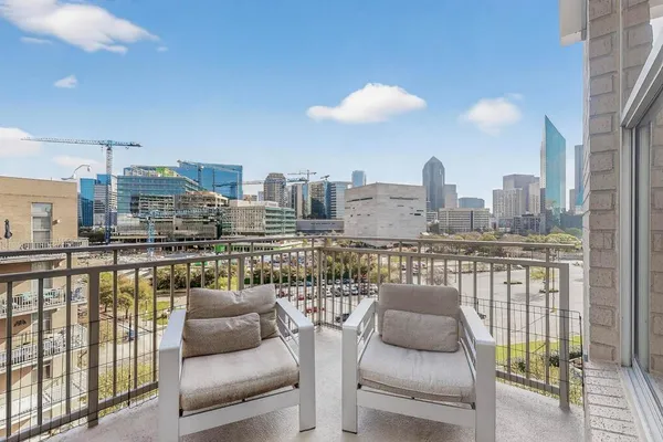a view of a balcony with city view