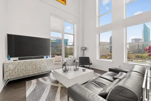 a living room with furniture and a flat screen tv
