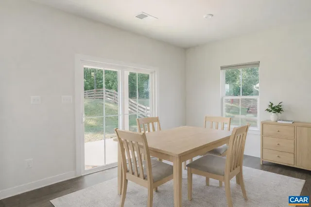 a kitchen with stainless steel appliances granite countertop a sink stove refrigerator and cabinets