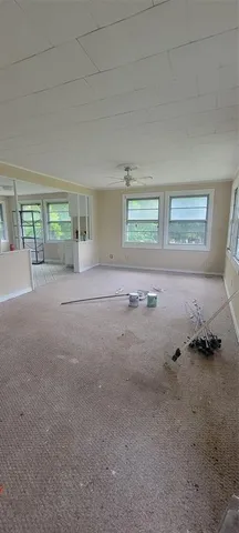 a view of a room with a floor to ceiling window