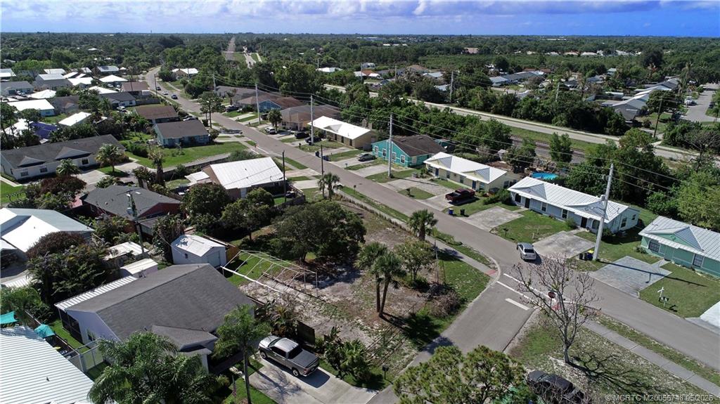 5152 Southeast Primrose Way Stuart, FL 34997 - Photo 8 of 13 an aerial view of a city with lots of residential buildings