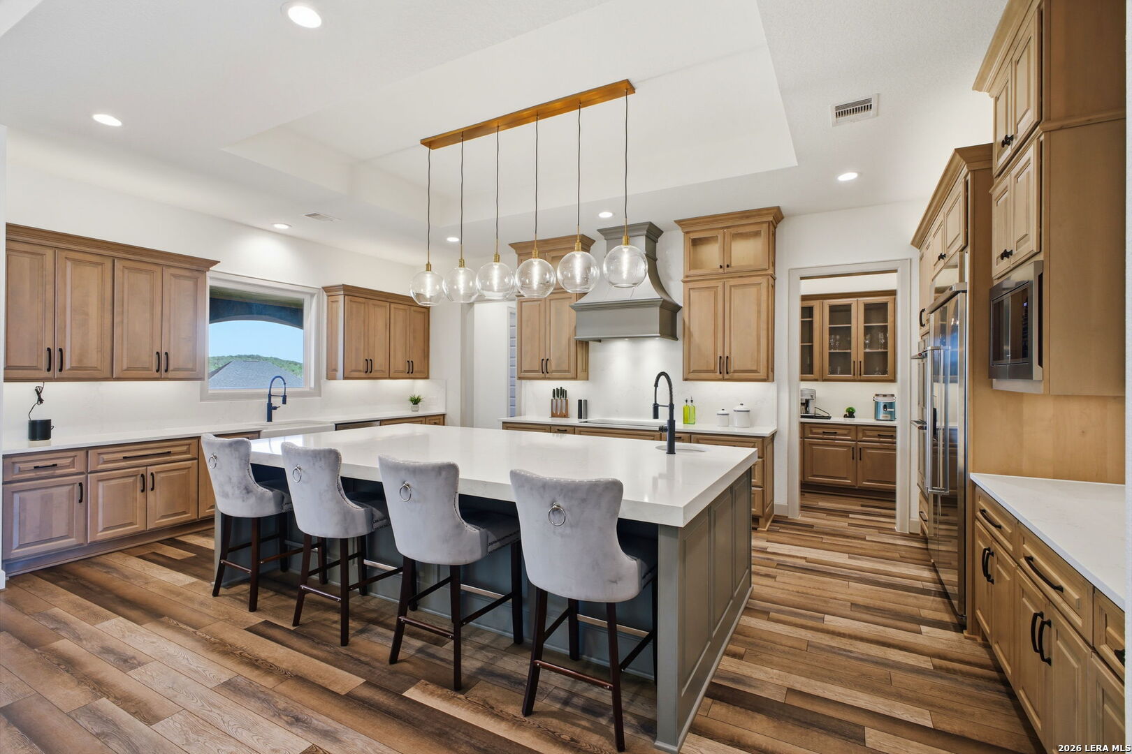 321 Vista View Place Spring Branch, TX 78070 - Photo 19 of 50 a large kitchen with a table and chairs