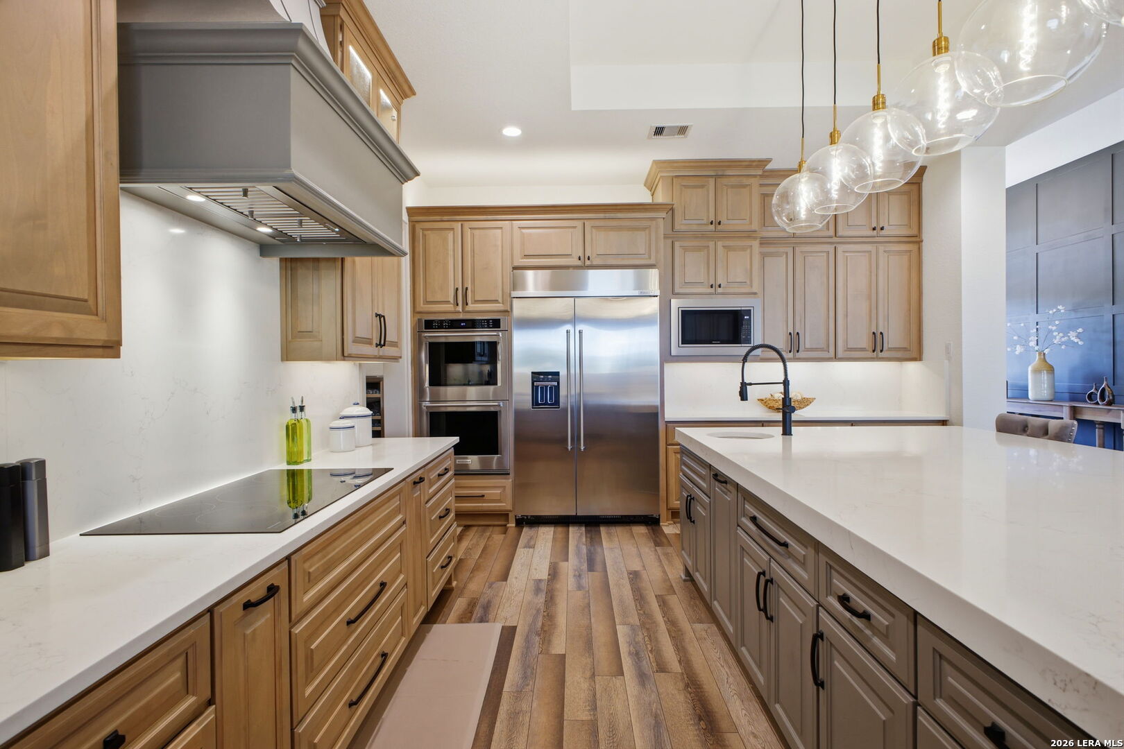 321 Vista View Place Spring Branch, TX 78070 - Photo 22 of 50 a kitchen with stainless steel appliances granite countertop a sink and a refrigerator