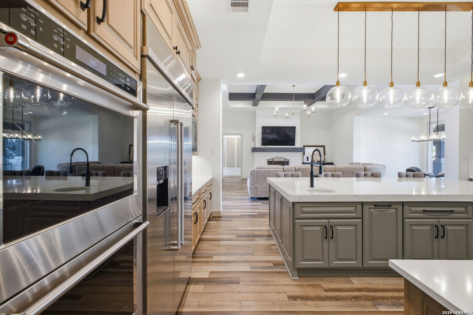 321 Vista View Place Spring Branch, TX 78070 - Photo 24 of 50 a large kitchen with stainless steel appliances kitchen island granite countertop a sink and cabinets