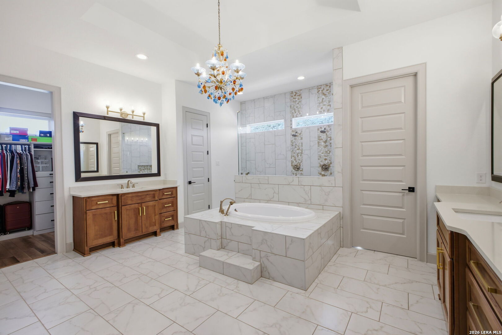321 Vista View Place Spring Branch, TX 78070 - Photo 27 of 50 a spacious bathroom with a granite countertop sink a toilet a mirror a bathtub and shower