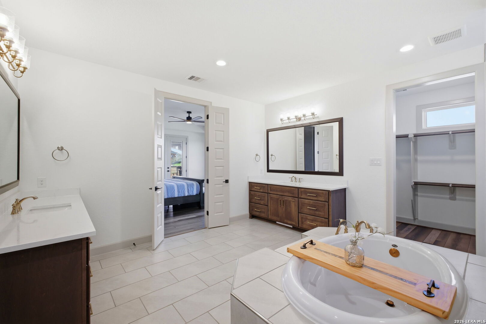 321 Vista View Place Spring Branch, TX 78070 - Photo 35 of 50 a bathroom with a tub sink and mirror