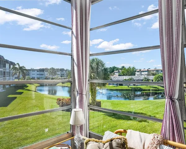 a view of swimming pool from a window