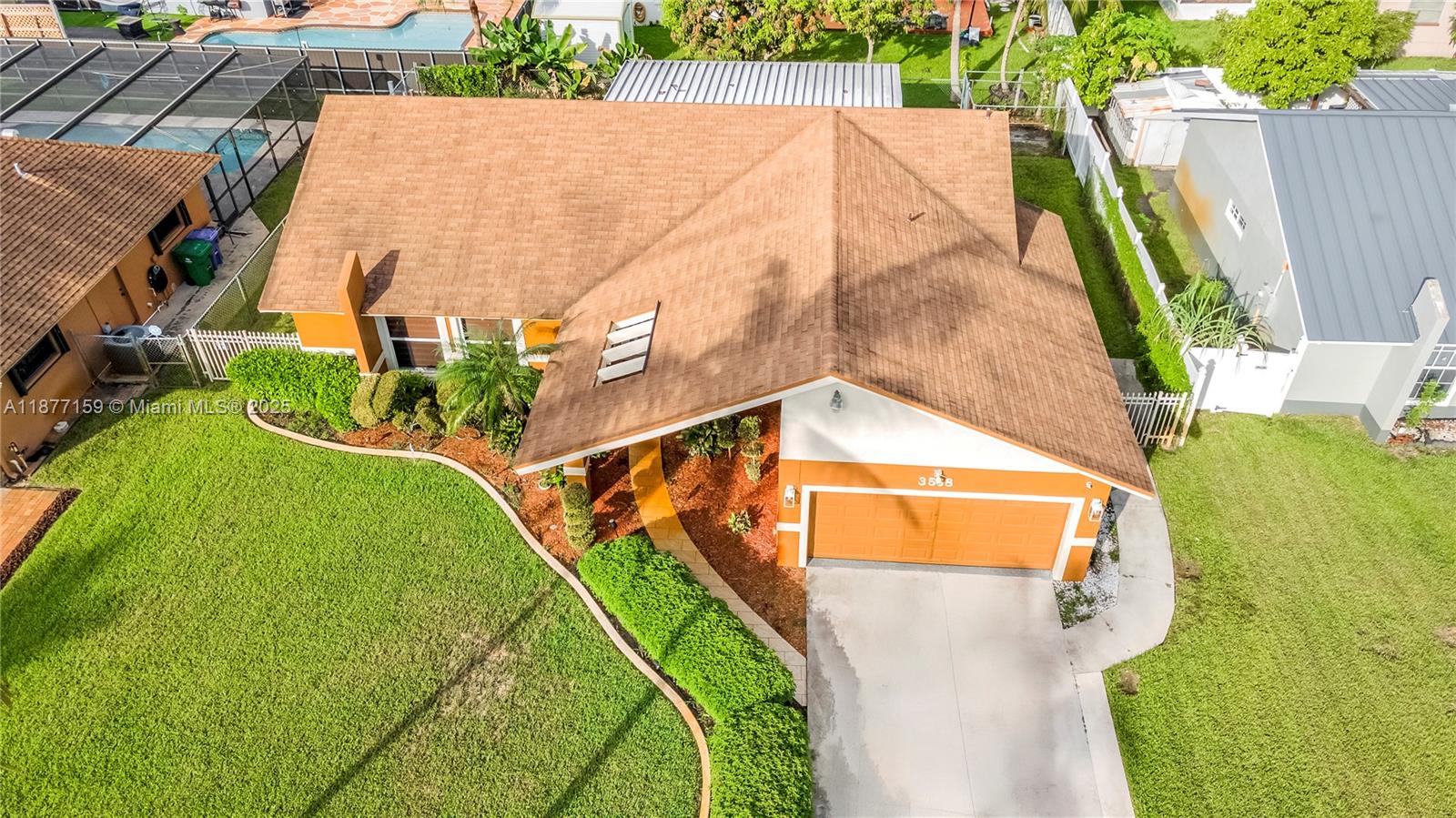 3568 Southwest 69th Way Miramar, FL 33023 - Photo 2 of 32 an aerial view of a house with swimming pool