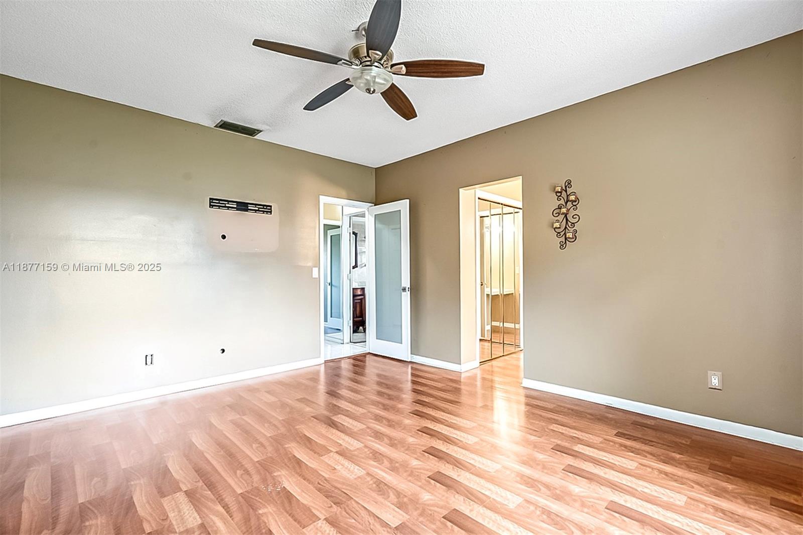 3568 Southwest 69th Way Miramar, FL 33023 - Photo 21 of 32 a view of empty room with wooden floor