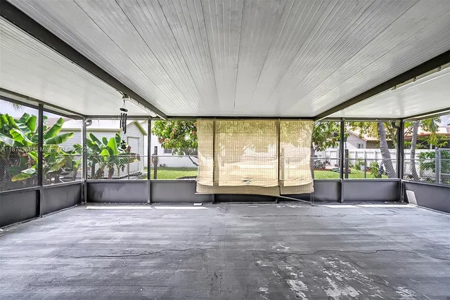 a view of an empty room with a sliding door
