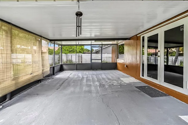 a view of a house with backyard and a garden