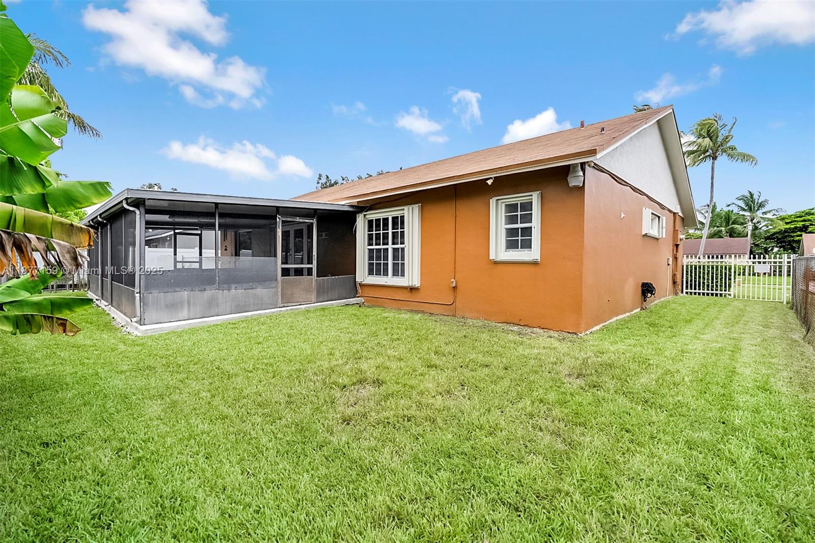 3568 Southwest 69th Way Miramar, FL 33023 - Photo 28 of 32 a view of a house with backyard and a garden