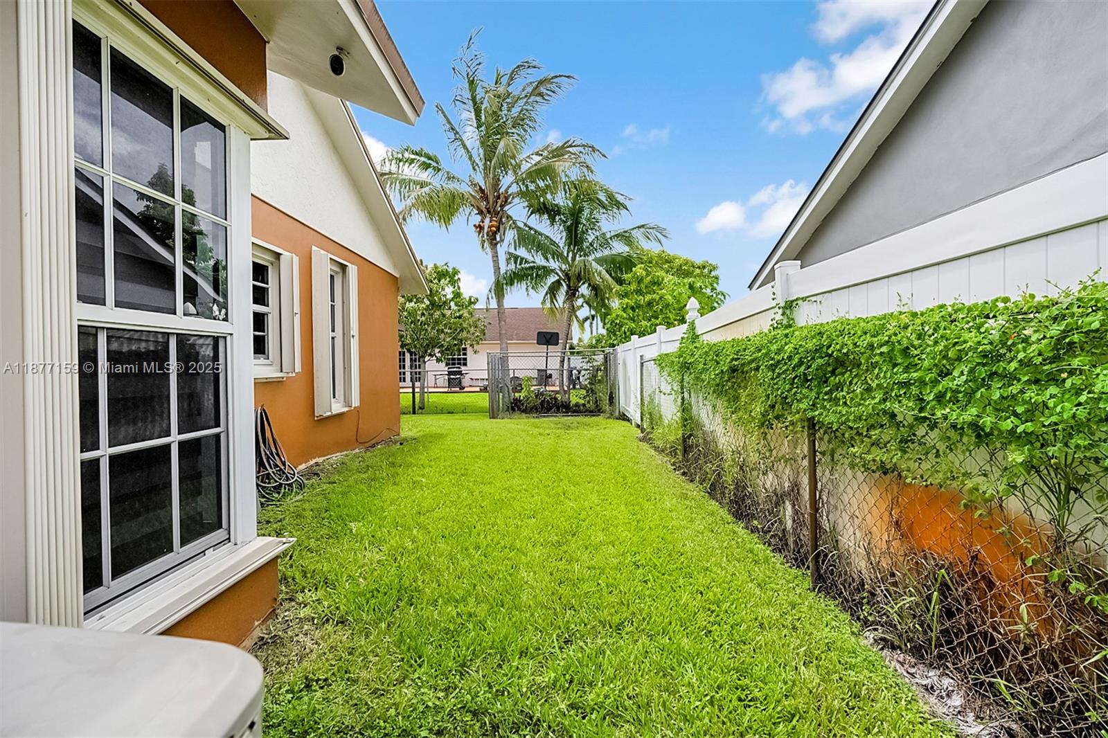 3568 Southwest 69th Way Miramar, FL 33023 - Photo 31 of 32 a view of house with backyard