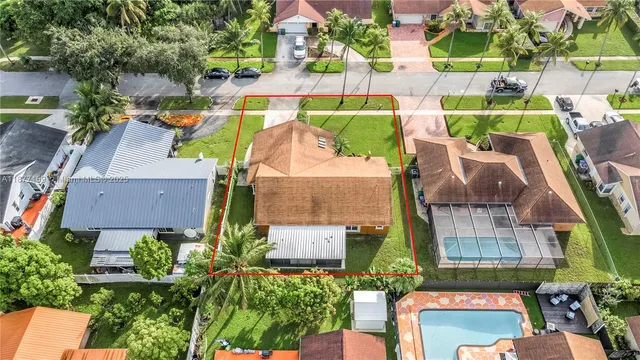 an aerial view of multiple houses with outdoor space