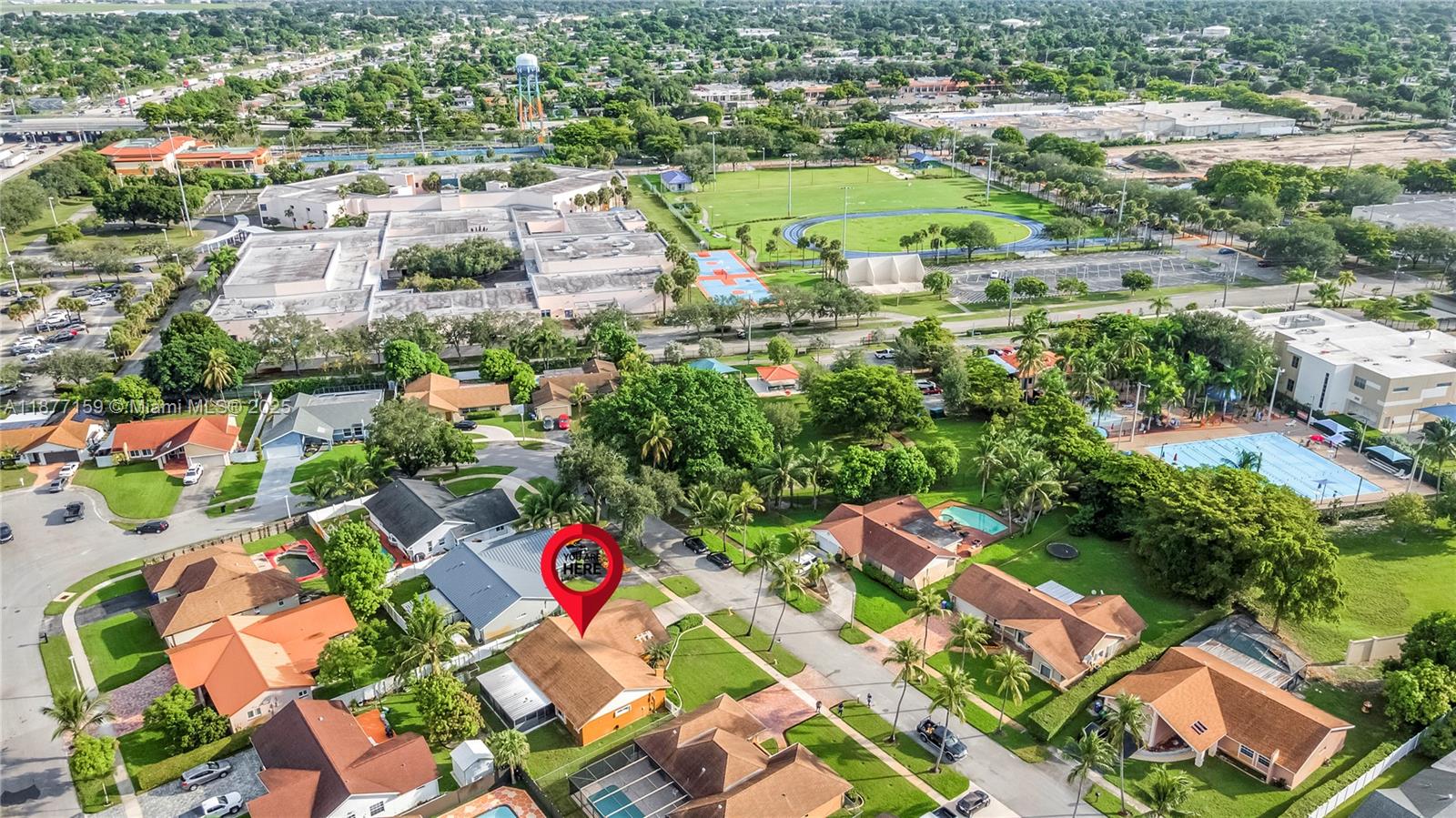 3568 Southwest 69th Way Miramar, FL 33023 - Photo 5 of 32 an aerial view of residential houses with outdoor space and swimming pool