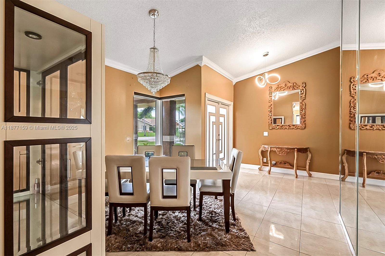 3568 Southwest 69th Way Miramar, FL 33023 - Photo 8 of 32 a dining room with wooden floor a glass table and chairs