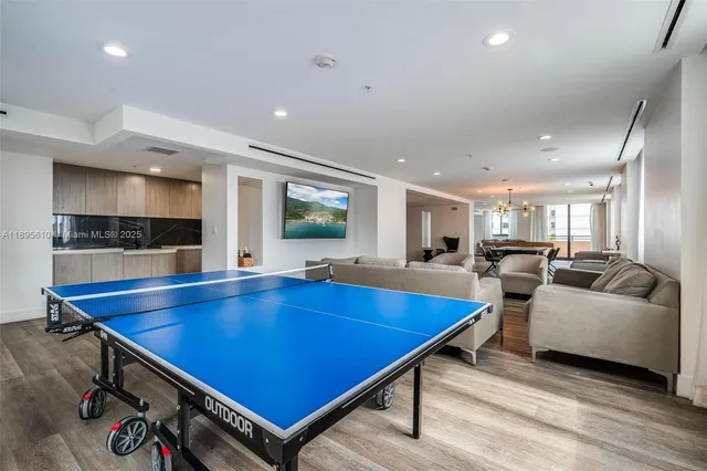 a view of kitchen with furniture and wooden floor