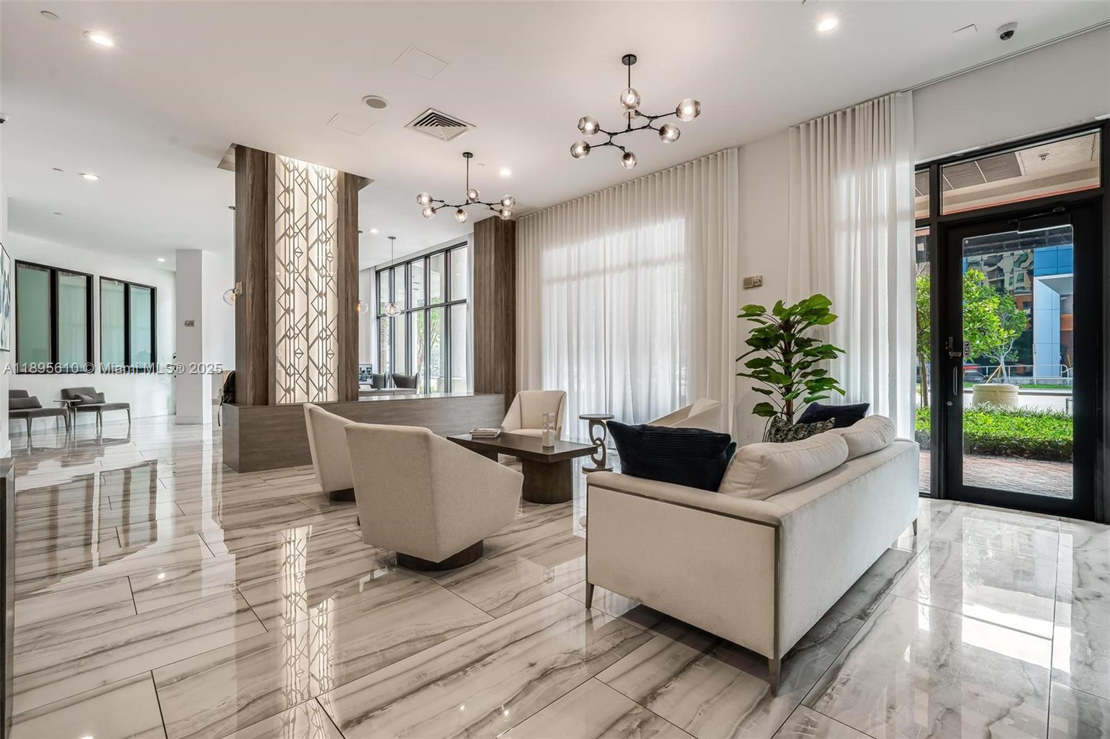 100 North Federal Highway, Unit 1413 Fort Lauderdale, FL 33301 - Photo 28 of 31 a living room with furniture and large windows