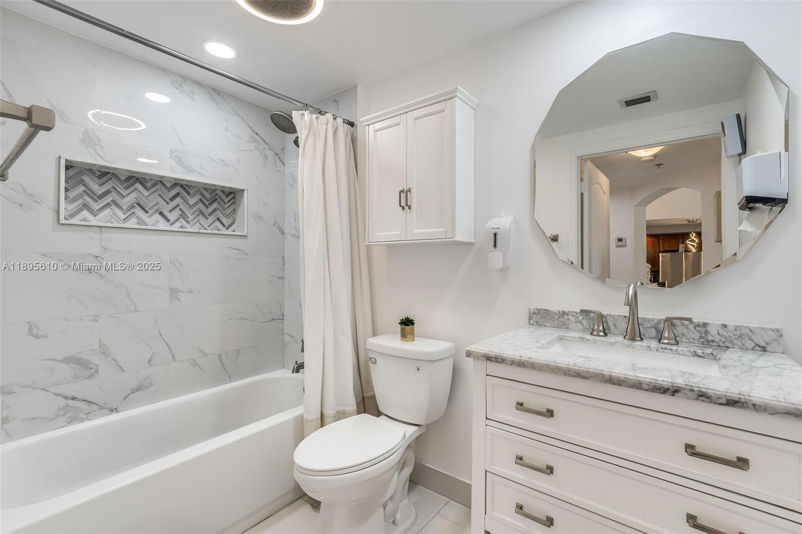100 North Federal Highway, Unit 1413 Fort Lauderdale, FL 33301 - Photo 6 of 31 a bathroom with a granite countertop sink toilet mirror and bathtub