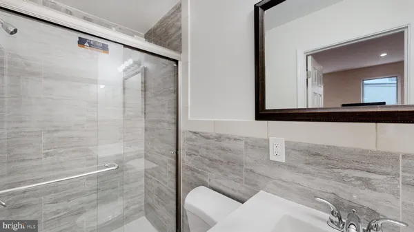 a bathroom with a toilet and a sink