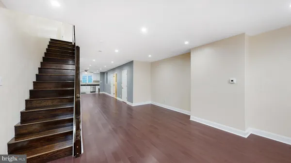 a kitchen with stainless steel appliances a refrigerator sink and microwave