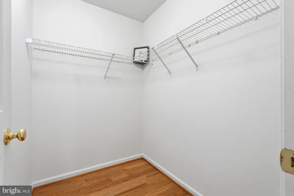 a spacious bathroom with a tub sink and mirror
