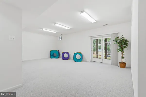 a view of a patio with wooden floor