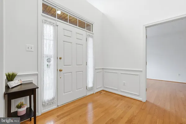 a view of a livingroom with furniture and wooden floor