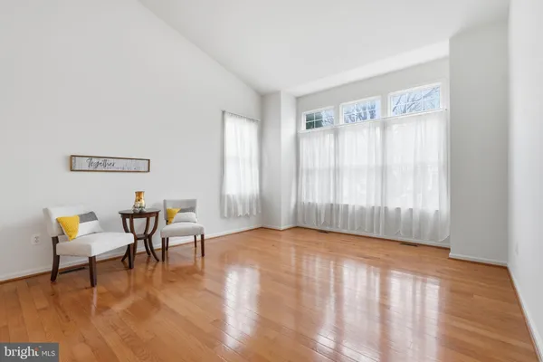 a view of an entryway with wooden floor