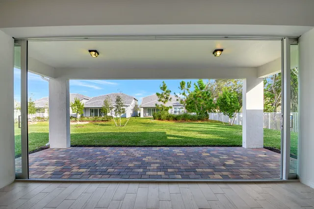 a view of a bench in front of a window