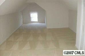 7016 Reedy Creek Road Charlotte, NC 28215 - Photo 2 of 6 a view of an empty room and window
