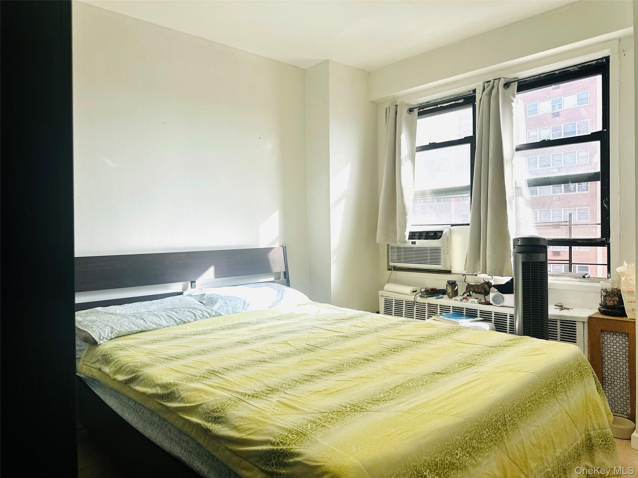 42-55 Colden Street, Unit 8N Queens, NY 11355 - Photo 3 of 7 a bedroom with a bed and a window