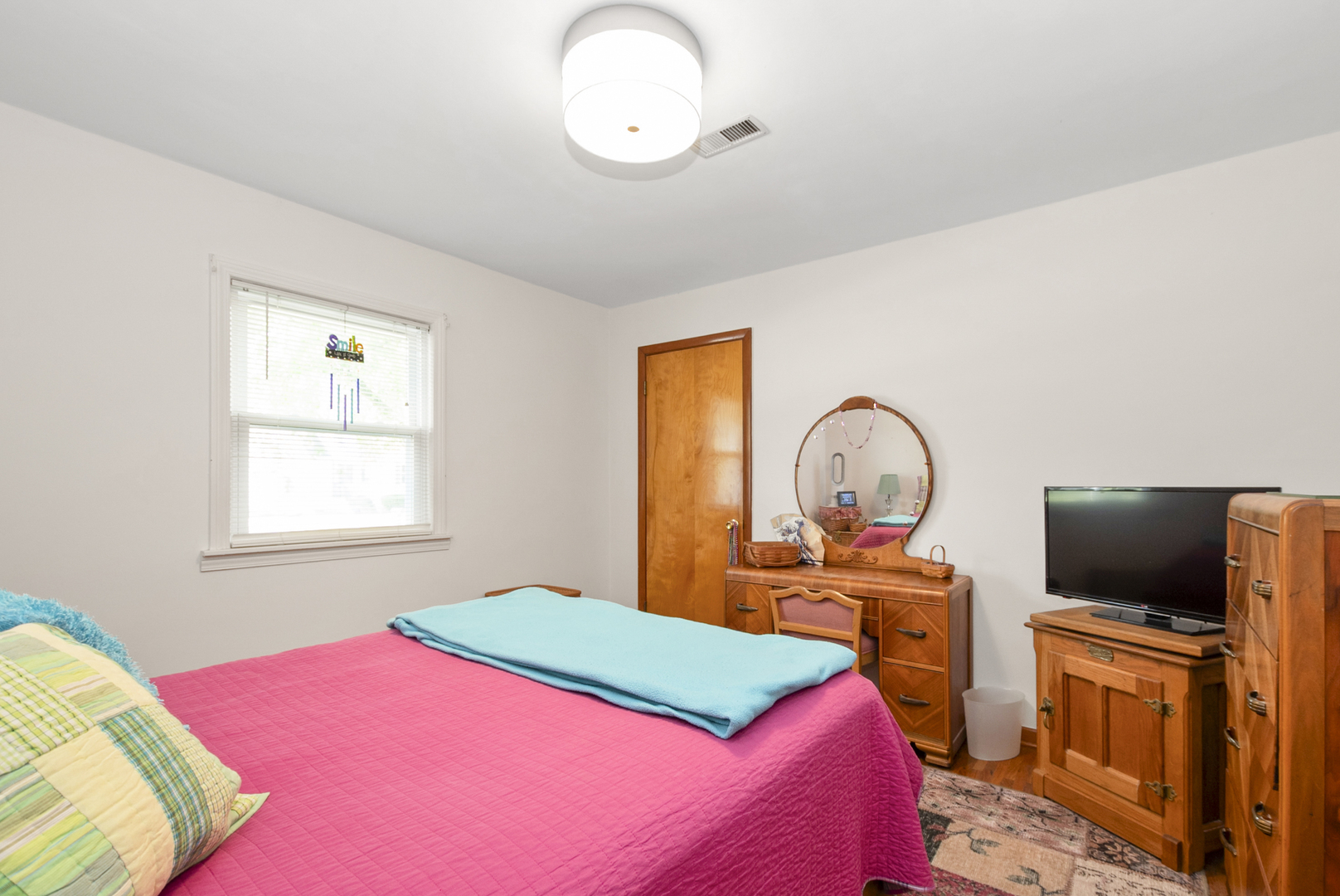 10832 Carpenter Street Mokena, IL 60448 - Photo 11 of 17 a bedroom with a bed and a flat screen tv