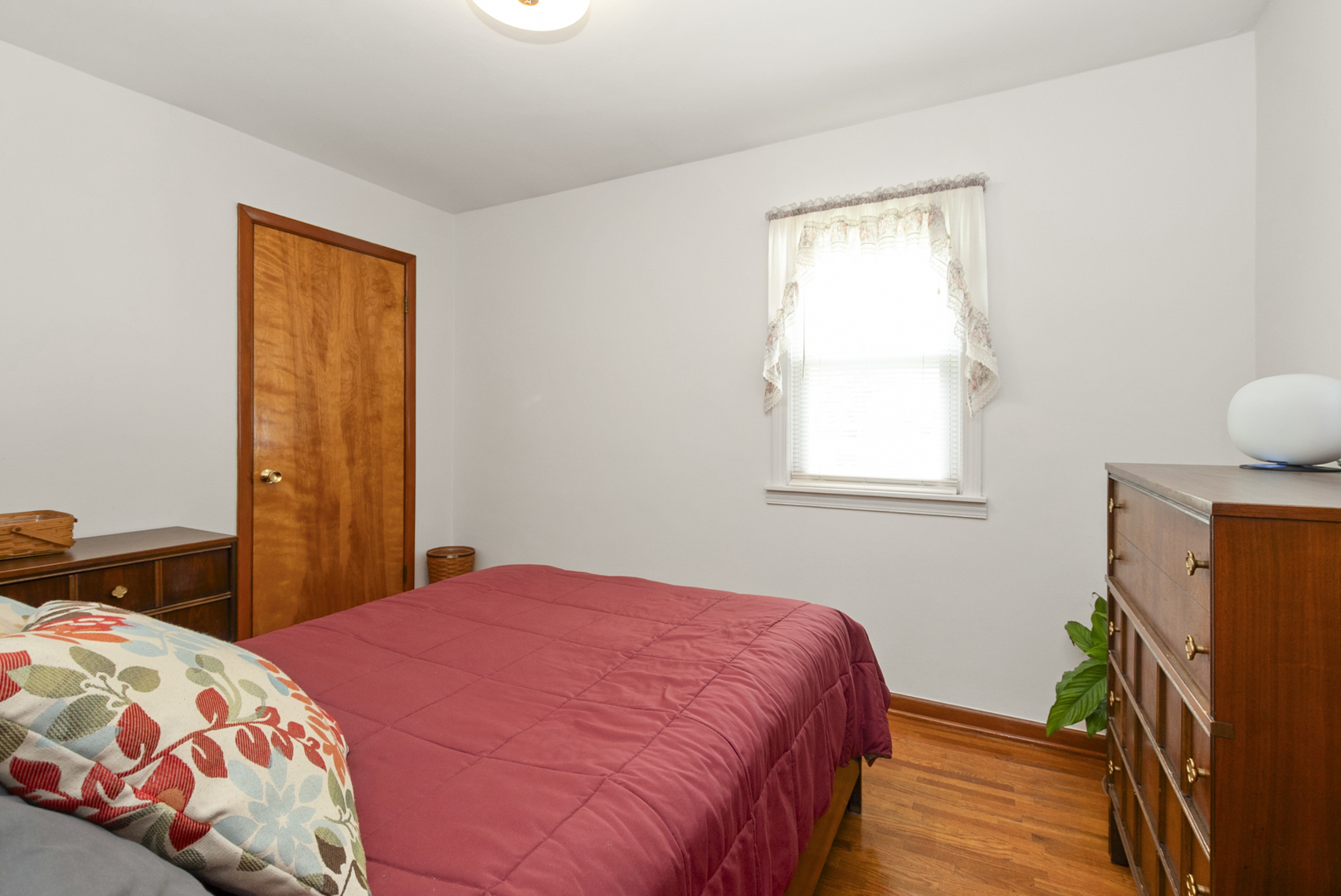 10832 Carpenter Street Mokena, IL 60448 - Photo 12 of 17 a bedroom with a bed and a window