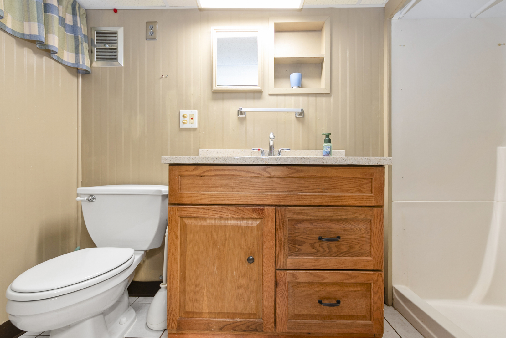 10832 Carpenter Street Mokena, IL 60448 - Photo 16 of 17 a bathroom with a toilet a sink a vanity and mirror