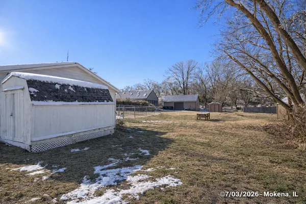 a view of a yard with a house