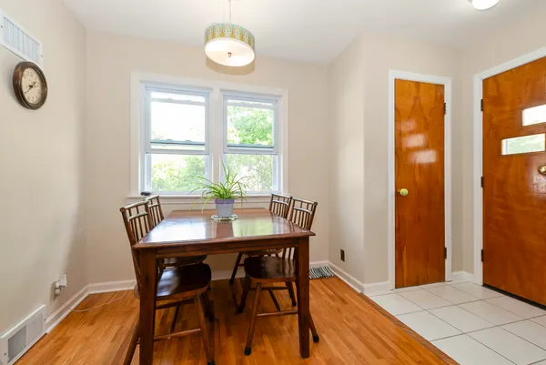 a view of a dining room with furniture and window
