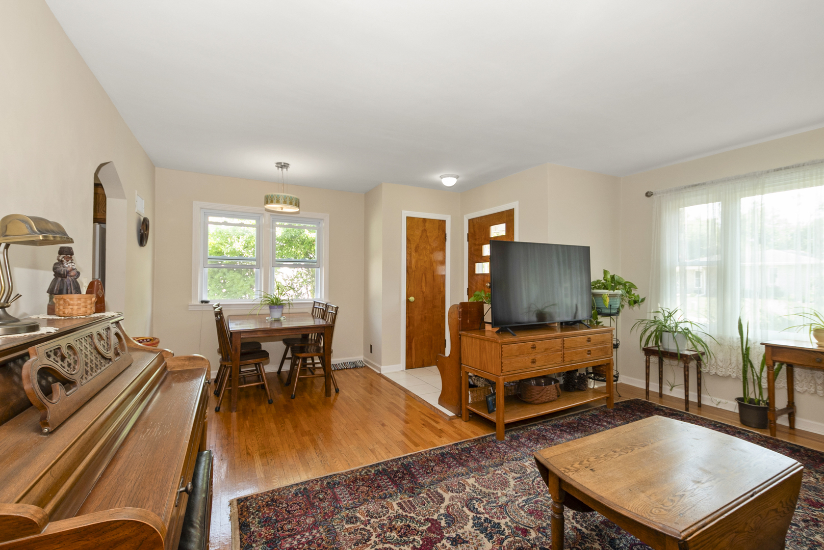10832 Carpenter Street Mokena, IL 60448 - Photo 7 of 17 a living room with furniture and a flat screen tv