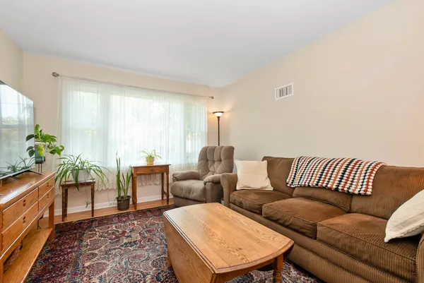 a living room with furniture and a rug