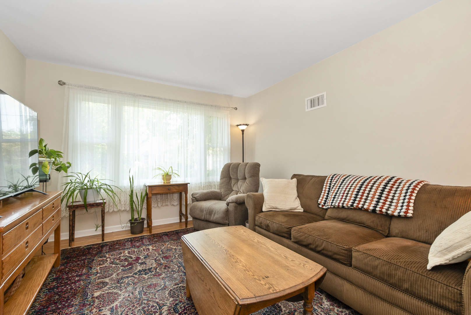 10832 Carpenter Street Mokena, IL 60448 - Photo 8 of 17 a living room with furniture and a rug