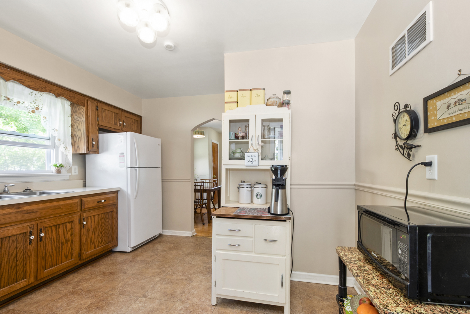 10832 Carpenter Street Mokena, IL 60448 - Photo 10 of 17 a kitchen with stainless steel appliances a refrigerator sink and cabinets