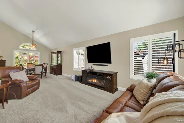 a dining room with furniture window and outside view